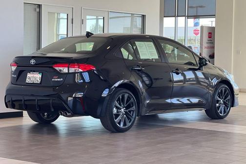 Midnight Black Metallic 2024 Toyota Corolla Hybrid SE
