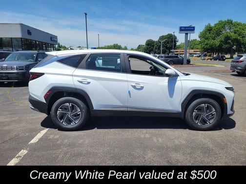 Creamy White Pearl 2026 Hyundai TUCSON Hybrid Blue SE