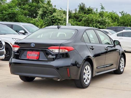 Midnight Black Metallic 2024 Toyota Corolla Hybrid LE
