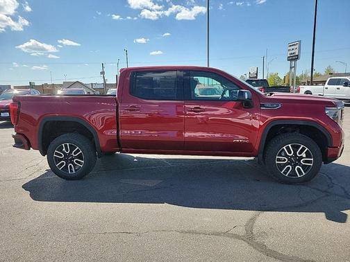 Volcanic Red Tintcoat 2026 GMC Sierra 1500 AT4