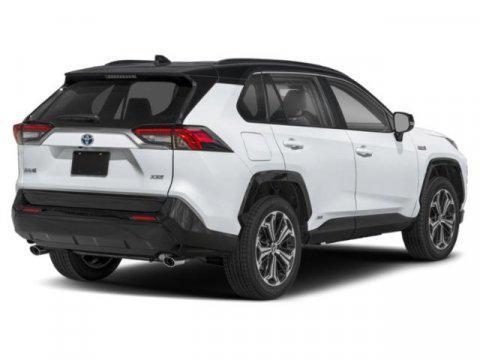 Supersonic Red/Midnight Black Metallic 2025 Toyota RAV4 Hybrid SE