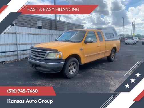 Yellow 2002 Ford F-150 XLT SuperCab