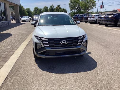 Creamy White Pearl 2026 Hyundai TUCSON Hybrid Blue SE