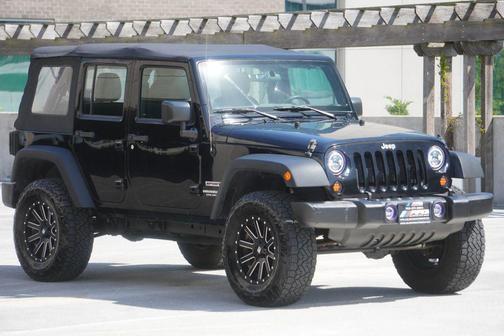 Black 2016 Jeep Wrangler Unlimited Sport
