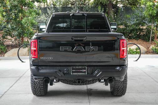 Diamond Black Crystal Pearlcoat 2026 RAM 1500 RHO Crew Cab 4x4 5'7' Box