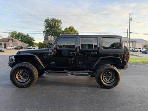 Black 2016 Jeep Wrangler Unlimited Sport