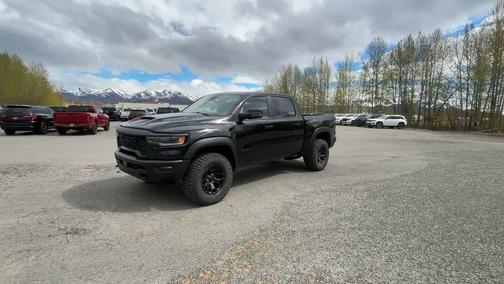 Diamond Black Crystal Pearlcoat 2026 RAM 1500 RHO Crew Cab 4x4 5'7' Box