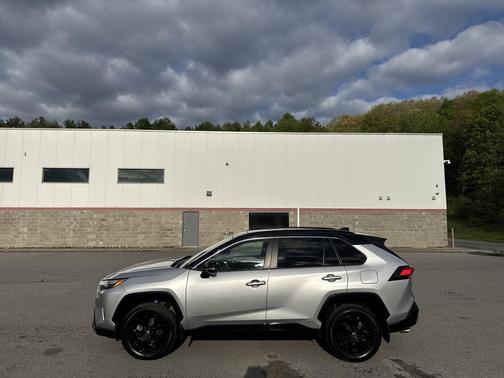 Silver Sky Metallic/Midnight Black Metallic 2023 Toyota RAV4 Hybrid SE