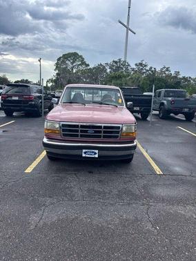 Red 1995 Ford F-150 XLT