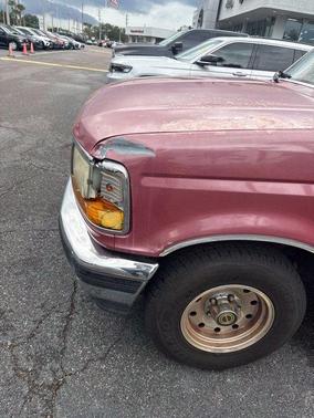 Red 1995 Ford F-150 XLT