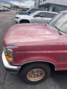 Red 1995 Ford F-150 XLT