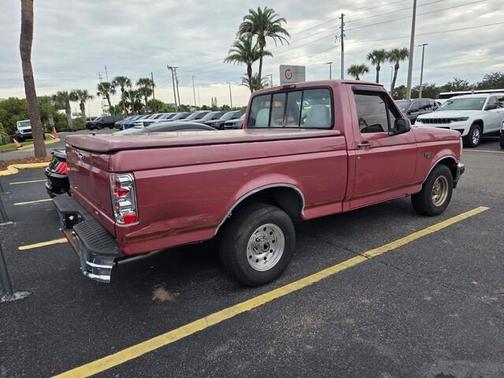 Red 1995 Ford F-150 XLT