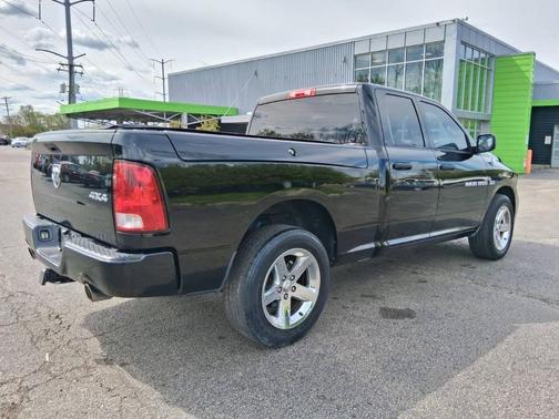 Black 2012 RAM 1500 Express 4x4 4dr Quad Cab 6.3 ft. SB Pickup