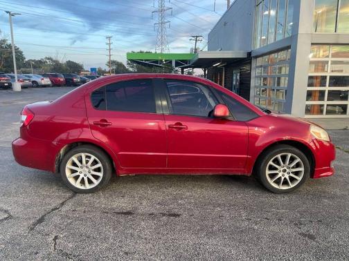 Red 2012 Suzuki SX4 LE 4dr Sedan