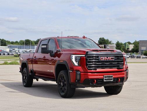 Volcanic Red Tintcoat 2024 GMC Sierra 3500 AT4