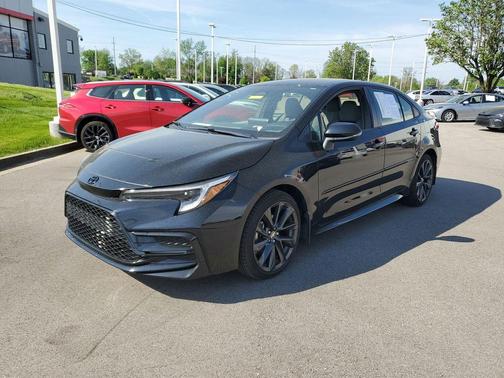 Midnight Black Metallic 2025 Toyota Corolla Hybrid SE