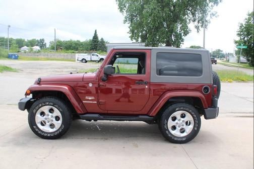 Maroon 2010 Jeep Wrangler Sahara