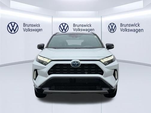 Wind Chill Pearl/Midnight Black Metallic 2024 Toyota RAV4 Hybrid SE