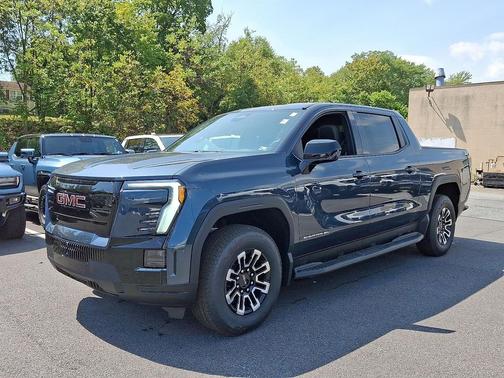 Deep Ocean Metallic 2026 GMC Sierra EV Extended Range Elevation
