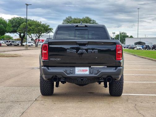 Diamond Black Crystal Pearlcoat 2026 RAM 1500 RHO Crew Cab 4x4 5'7' Box