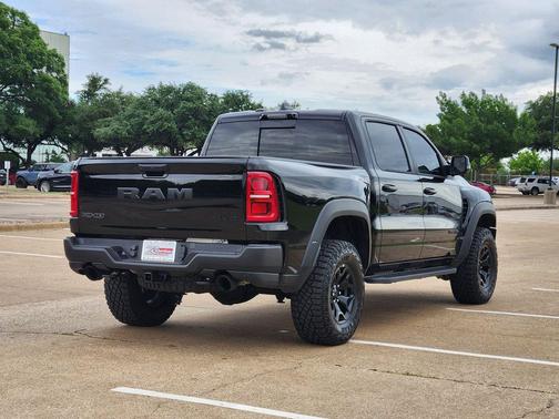 Diamond Black Crystal Pearlcoat 2026 RAM 1500 RHO Crew Cab 4x4 5'7' Box