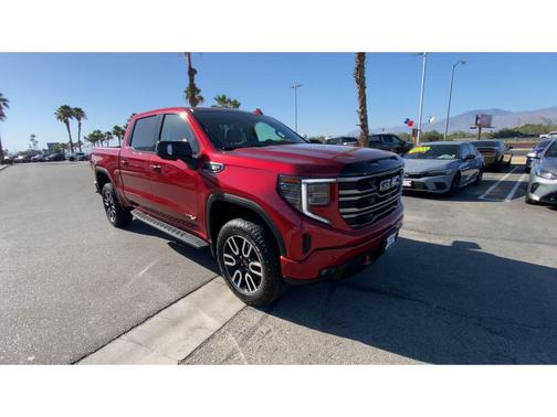 Volcanic Red Tintcoat 2025 GMC Sierra 1500 AT4