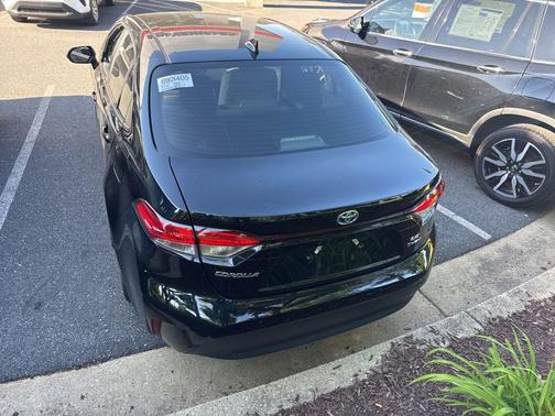 Midnight Black Metallic 2025 Toyota Corolla Hybrid LE