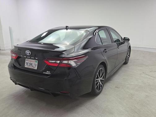 Midnight Black Metallic 2024 Toyota Camry Hybrid SE