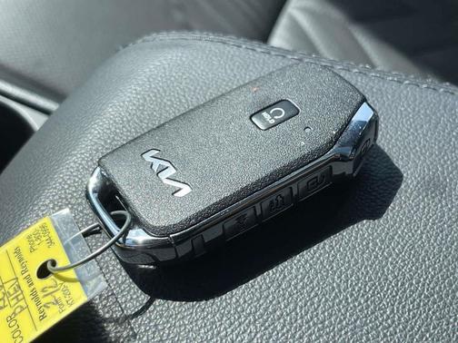 Dawning Red 2025 Kia Sportage Plug-In Hybrid X-Line