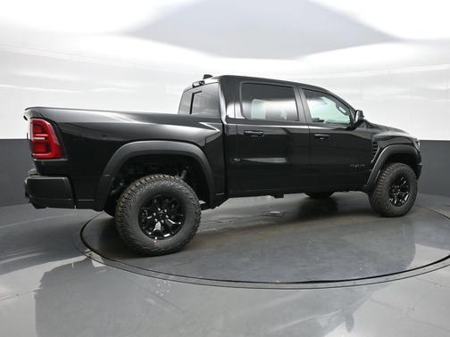 Diamond Black Crystal Pearlcoat 2026 RAM 1500 RHO Crew Cab 4x4 5'7' Box