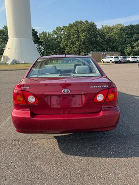 Red 2004 Toyota Corolla LE