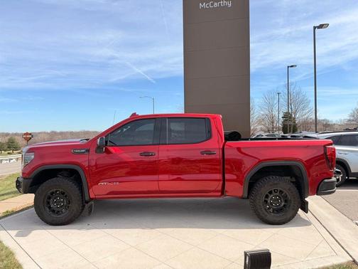 Volcanic Red Tintcoat 2024 GMC Sierra 1500 AT4X