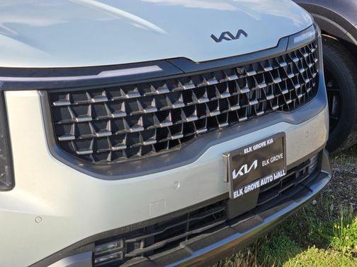 Ivory 2026 Kia Carnival Hybrid SX