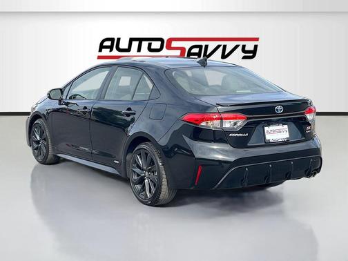 Midnight Black Metallic 2025 Toyota Corolla Hybrid SE