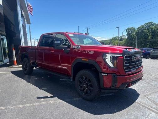 Volcanic Red Tintcoat 2026 GMC Sierra 2500 AT4