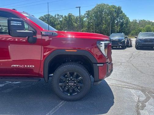Volcanic Red Tintcoat 2026 GMC Sierra 2500 AT4