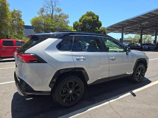 Silver Sky Metallic/Midnight Black Metallic 2023 Toyota RAV4 Hybrid SE