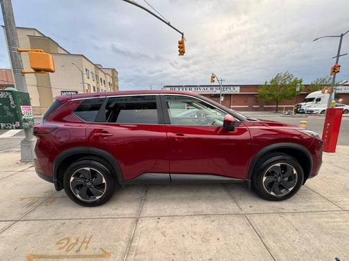Red 2025 Nissan Rogue SV