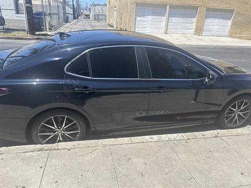 Midnight Black Metallic 2024 Toyota Camry Hybrid SE