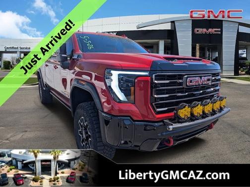 Volcanic Red Tintcoat 2025 GMC Sierra 2500 AT4X