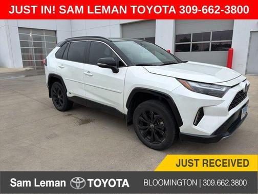 Wind Chill Pearl/Midnight Black Metallic 2023 Toyota RAV4 Hybrid SE