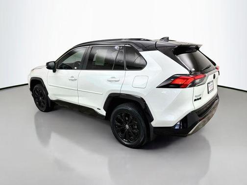 Wind Chill Pearl/Midnight Black Metallic 2023 Toyota RAV4 Hybrid SE