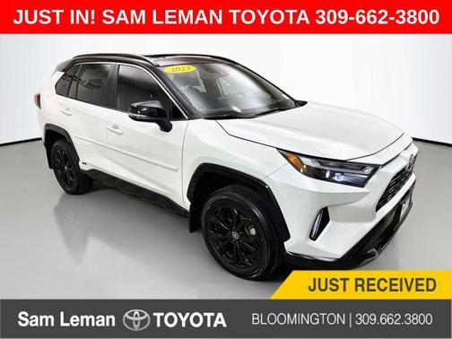 Wind Chill Pearl/Midnight Black Metallic 2023 Toyota RAV4 Hybrid SE