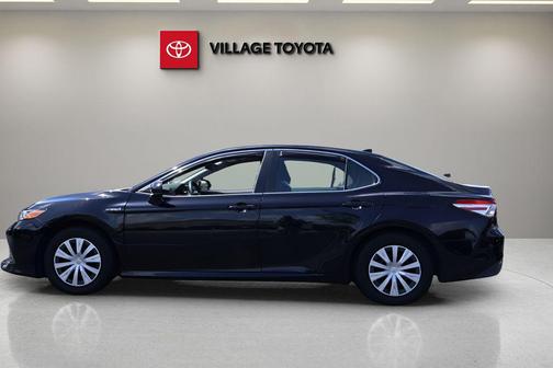 Midnight Black Metallic 2019 Toyota Camry Hybrid LE