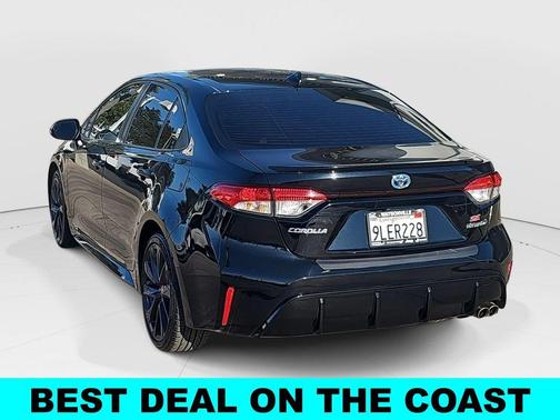 Midnight Black Metallic 2024 Toyota Corolla Hybrid SE