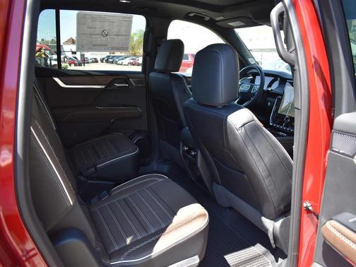 Volcanic Red Tintcoat 2026 GMC Acadia Denali