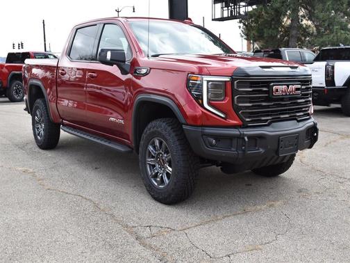 Volcanic Red Tintcoat 2026 GMC Sierra 1500 AT4X