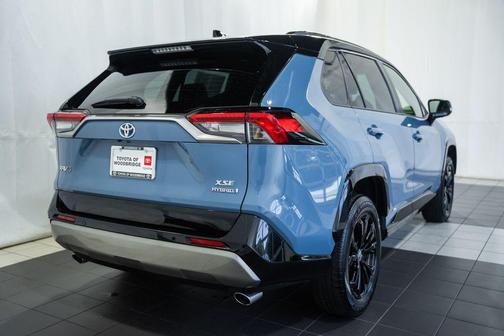 Cavalry Blue/Midnight Black Metallic 2024 Toyota RAV4 Hybrid SE
