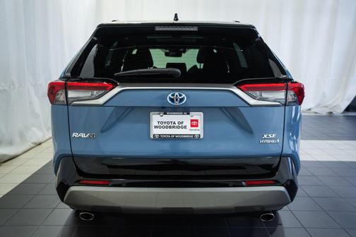 Cavalry Blue/Midnight Black Metallic 2024 Toyota RAV4 Hybrid SE