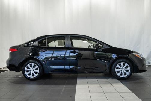 Midnight Black Metallic 2025 Toyota Corolla Hybrid LE